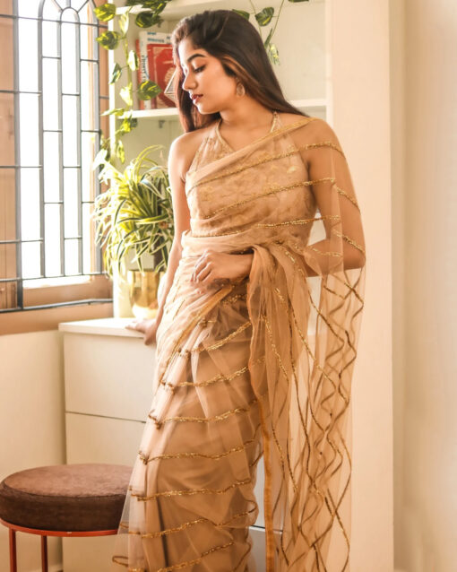 Glamorous Beige Color Net Saree With Sequins Work Blouse